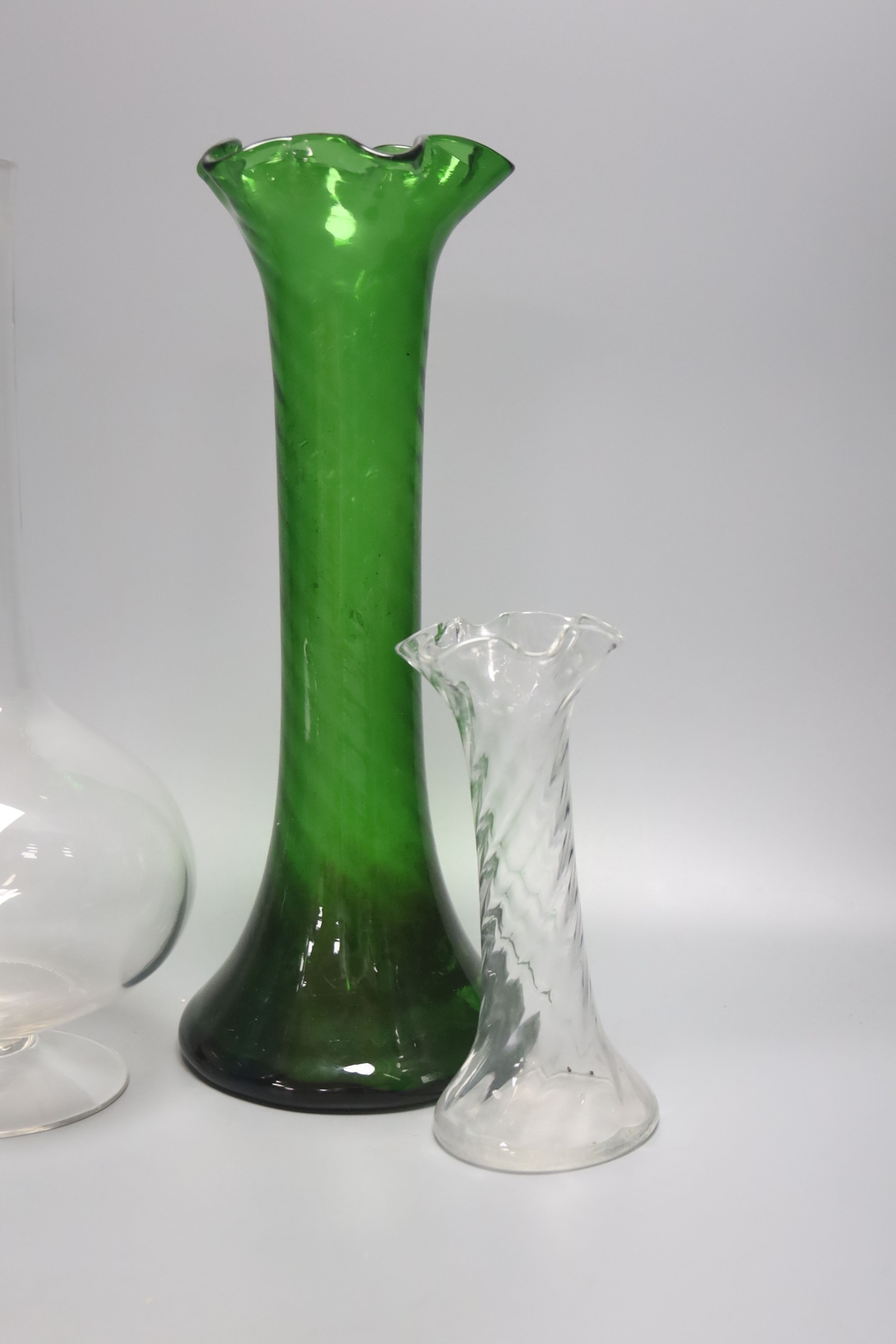 Two green glass hyacinth vases, a carafe and two other vases 30.5cm
